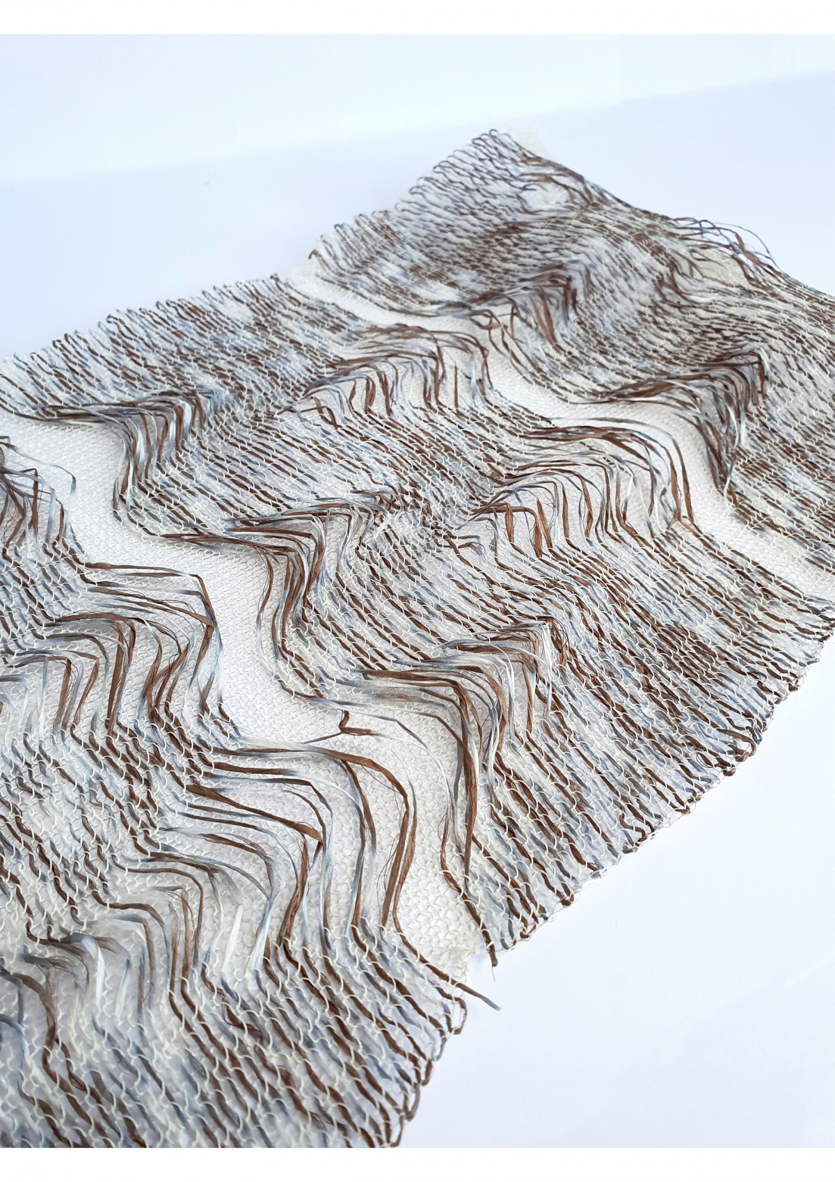 Logwood dyed silk paper pattern woven into fine paper knit