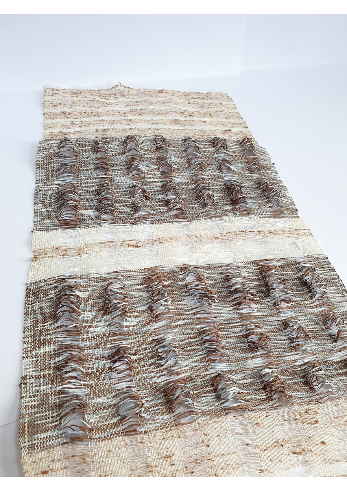 Woven fabric with Buckthorn dyed silk and paper contrasting with fine white paper and raw silk