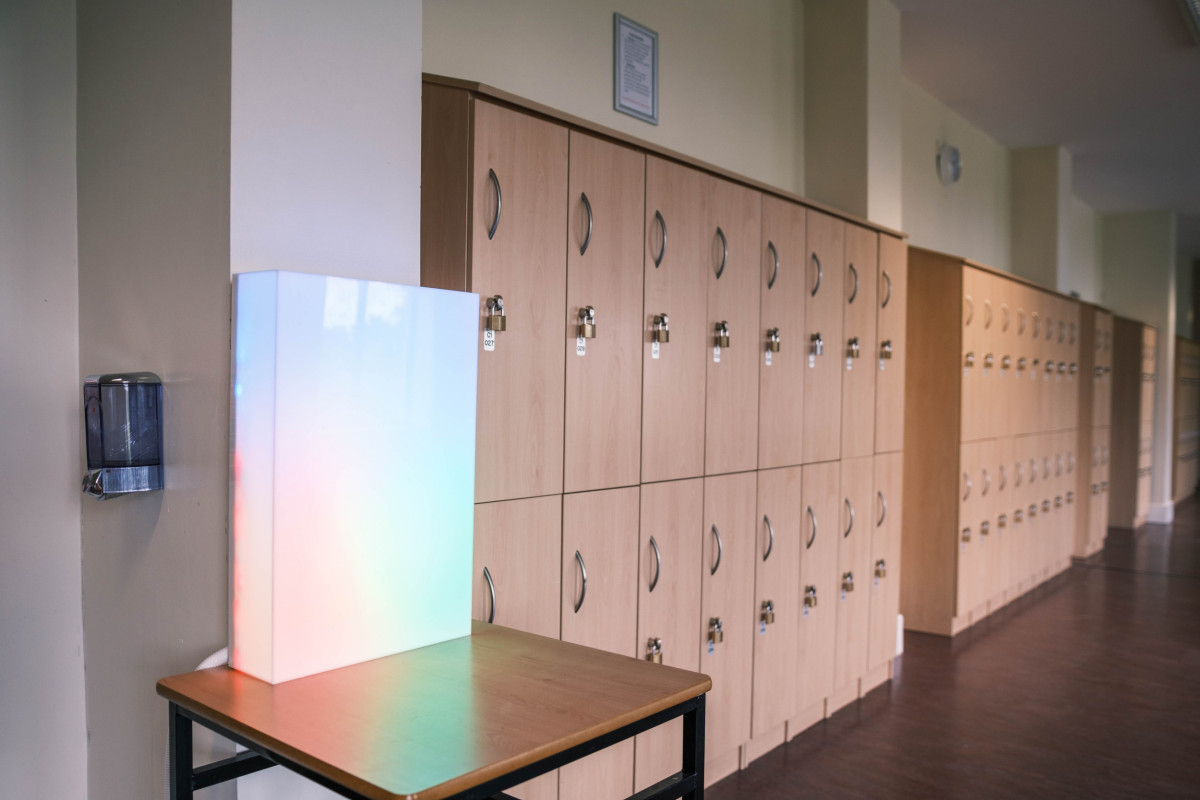 The light box is designed to be situated in a communal area in the school. This encourages the fostering of a peer supported community through whole school involvement