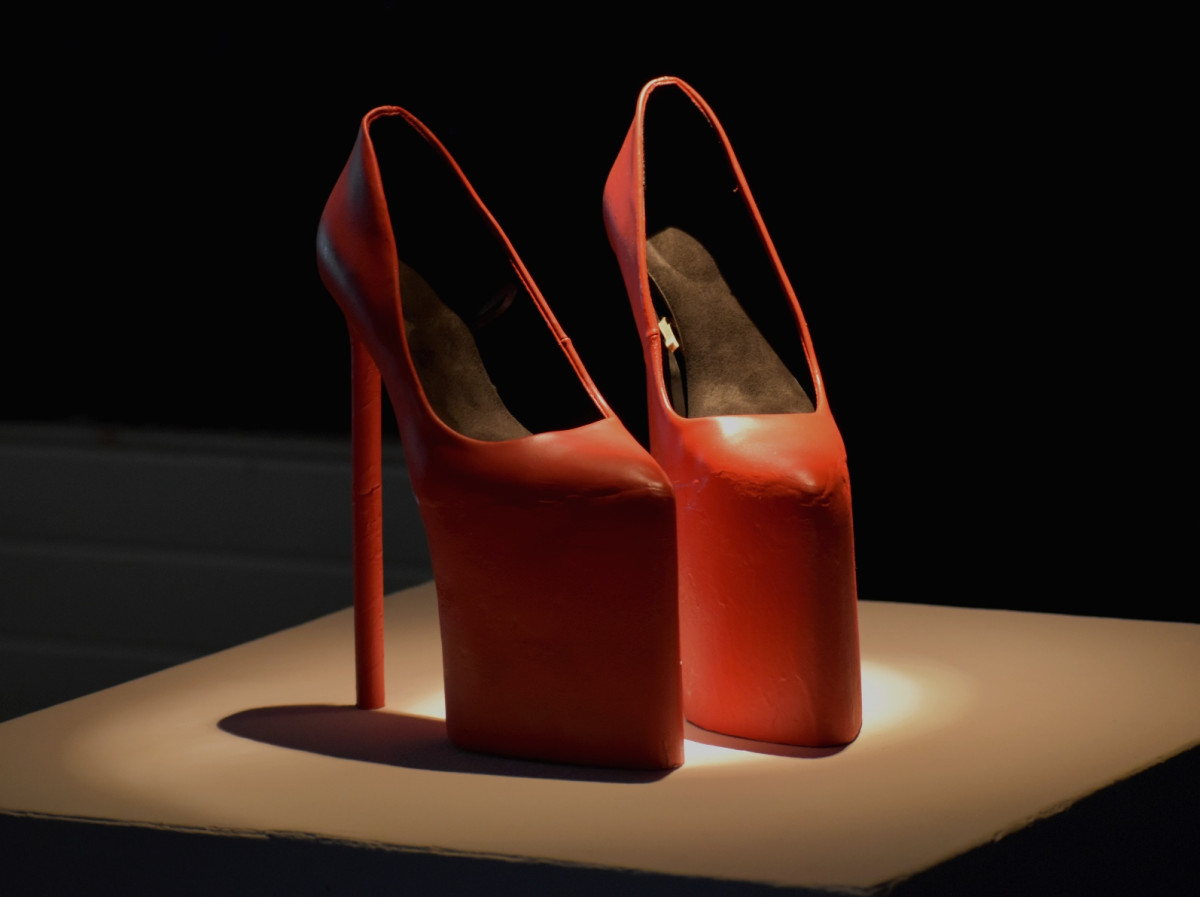 'Ready for mating season!'; Platform heels made made using real high heels with the addition of wooden base and paper straws. Connected using clay and spray painted using white and red colouring.