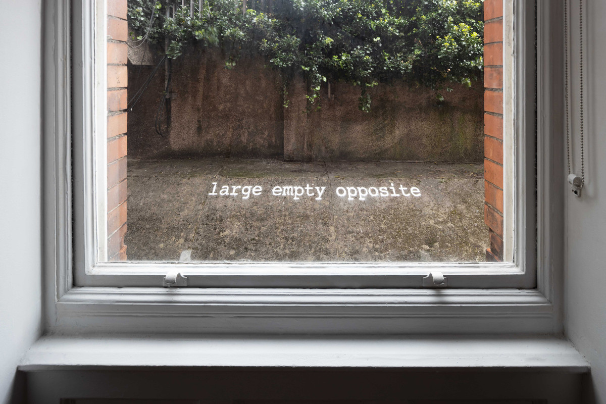 'Large Empty Opposite'; Chalk spray paint, 29.7 x 294cm. Photo: Kate Bowe O'Brien