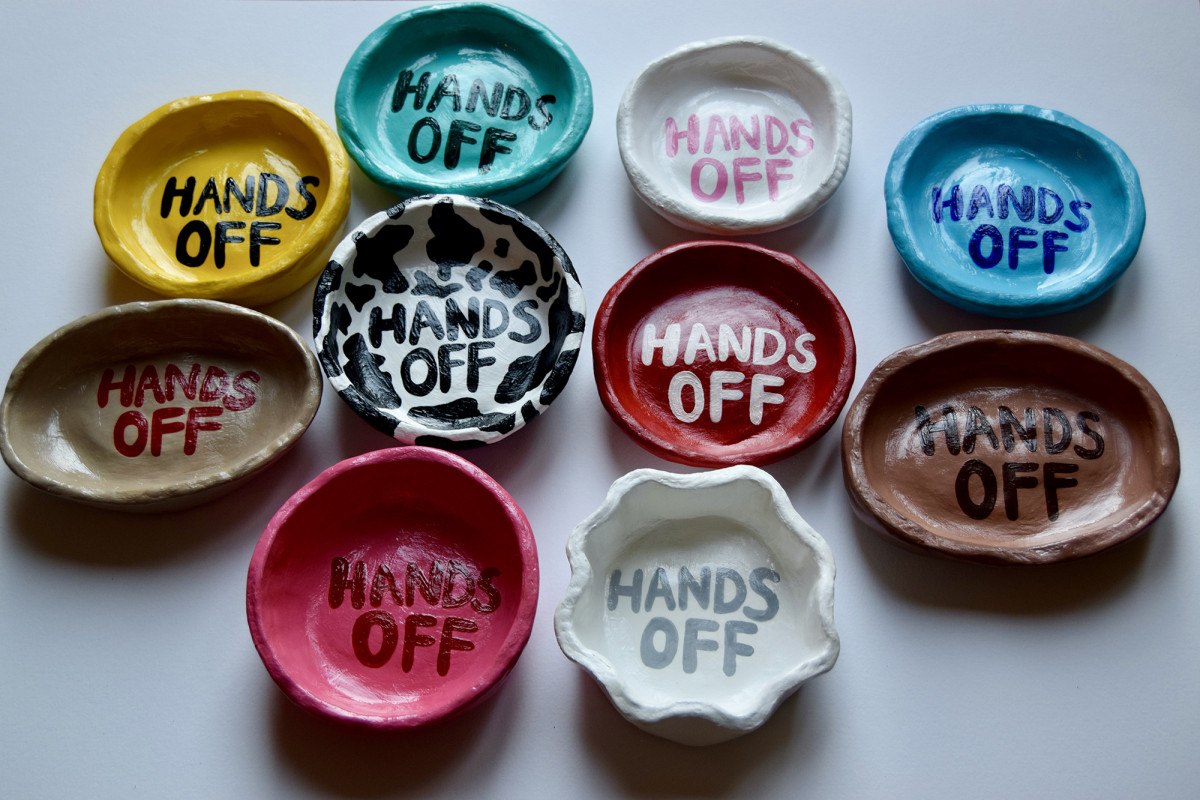 'Hands Off;  Clay pots created as a comment on vegan advertisements in the media. The message 
